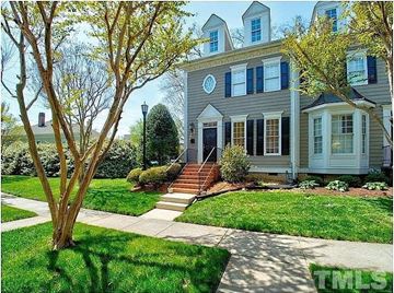 Raleigh apartment for rent - A house with a grey facade and a white door.