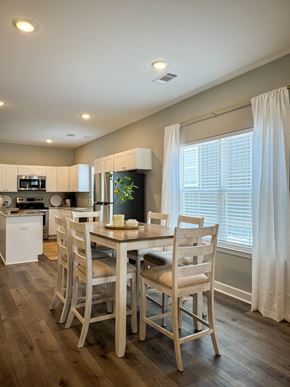 Little Rock house for rent - A dining room with a table set for four.