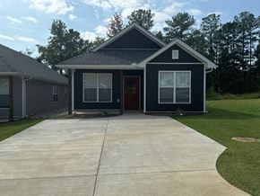 Little Rock house for rent - A house with a grey roof and a red door.