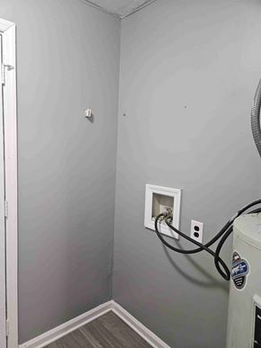Albany apartment for rent - A wall socket with a black cord plugged into it.