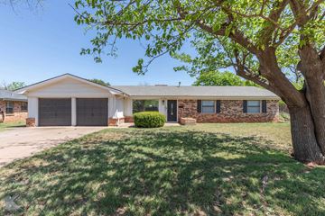 Abilene house for rent - A house with a tree in front of it.