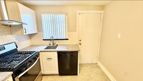 Lakewood apartment for rent - A room with wooden flooring and a window with blinds.