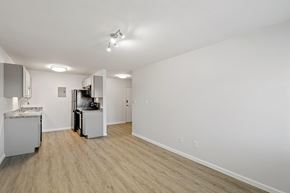 Longmont apartment for rent - A kitchen area with a sink, refrigerator, and a microwave.