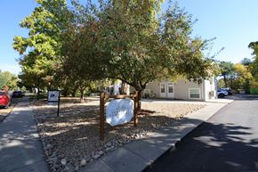 Longmont apartment for rent - A sign in front of a building that says Sherri's Tow.