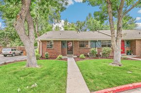 Lakewood apartment for rent - A red brick house with a red door and a red awning.