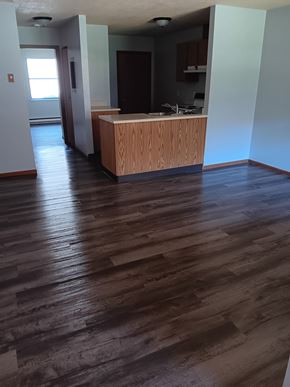 Salineville apartment for rent - A room with a wooden floor and a counter.