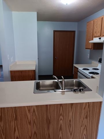 Salineville apartment for rent - A kitchen with a sink and stove.