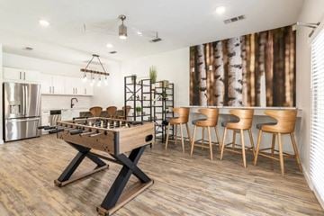 Cleveland apartment for rent - A modern kitchen with a wooden table and chairs.