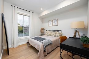 Hudson apartment for rent - A bedroom with a bed, a desk, and a chair.