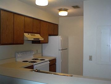 Beaufort - Coming Available 8/21/26 apartment for rent - A kitchen with a white refrigerator and a white stove top.