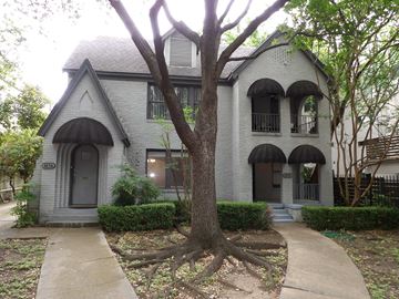 Dallas apartment for rent - A tree in front of a house.