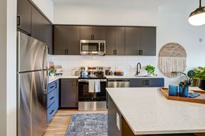 Mesa apartment for rent - kitchen with espresso cabinets and white quartz counters