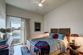Mesa apartment for rent - bedroom with queen sized bed and sliding door to balcony