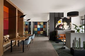 Mesa apartment for rent - A modern dining room with a wooden table and chairs.