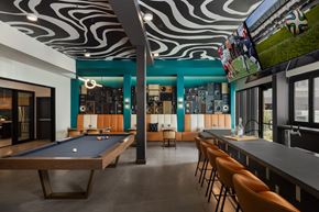 Mesa apartment for rent - A room with a pool table and a bar area.