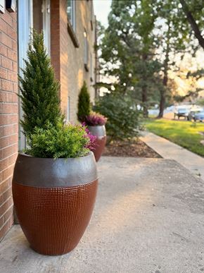 Lakewood apartment for rent - A brick building with a green pole in front of it.