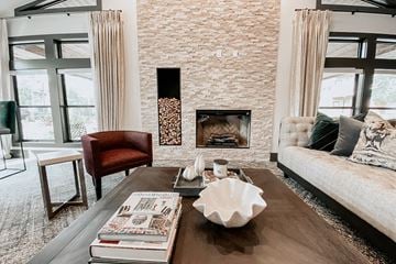 Duluth apartment for rent - a living room with a fireplace and a couch and a coffee table