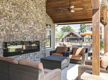 The arbors at breckinridge apartment homes poolside seating and fireplace