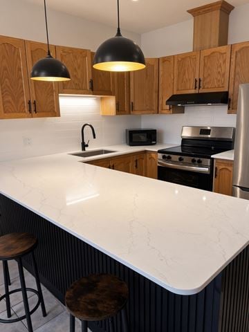 Toronto apartment for rent - A kitchen with a white counter top and wooden cabinets.