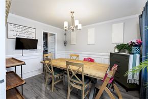 Clarksville house for rent - A dining room with a wooden table and chairs.