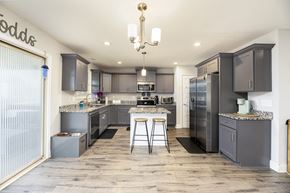 Clarksville house for rent - A modern kitchen with a large island and bar stools.