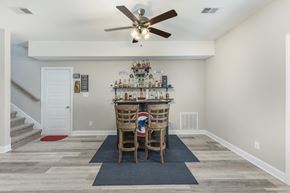 Clarksville house for rent - A dining room with a wooden table and chairs.