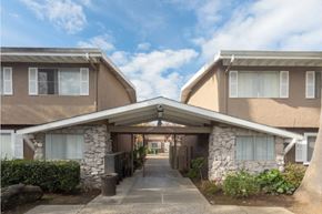 San Jose apartment for rent - A residential area with two houses connected by a bridge.