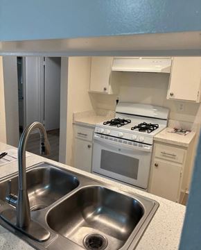 Buena Park apartment for rent - A kitchen with a stove, sink, and oven.