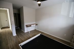 Denver apartment for rent - A room with a pool table and a bench.