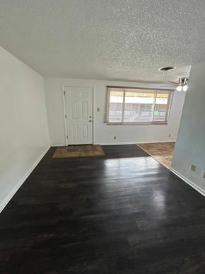Lakewood apartment for rent - A room with a white door and a window with blinds.