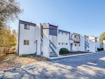 Lakewood apartment for rent - A white building with a blue sky in the background.