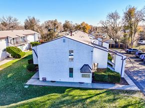 Lakewood apartment for rent - A white house with a grey roof and a small porch.