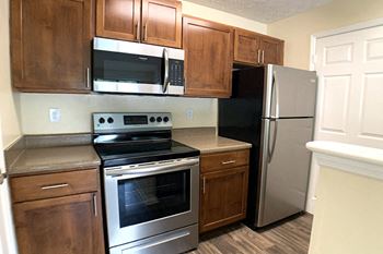 Park trace apartments full kitchen with stainless steel appliances