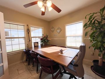 Bay City house for rent - A dining room with a wooden table and chairs.