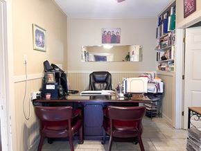 Bay City house for rent - A room with a desk and chairs.
