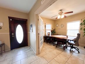 Bay City house for rent - A room with a table and chairs and a ceiling fan.
