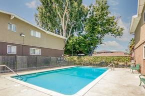 San Jose apartment for rent - A small pool in a backyard surrounded by a fence.