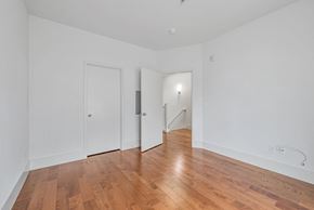 Palo Alto house for rent - A room with wooden floors and white walls.