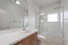 Palo Alto house for rent - A white bathroom with a sink, toilet, and shower.
