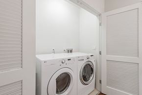 Palo Alto house for rent - A white washing machine and dryer in a laundry room.