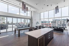 Calgary apartment for rent - A modern office space with a long table and chairs.