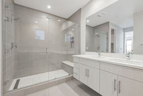 Santa Clara house for rent - A modern bathroom with a walk-in shower and double sinks.