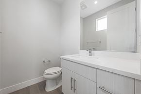 Santa Clara house for rent - A white bathroom with a toilet and sink.