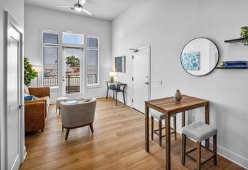 Knoxville apartment for rent - A living room with a brown chair and a wooden table.