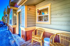 Pagosa Springs apartment for rent - A house with a blue door and a window with a view of the sky.