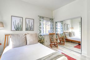 Pagosa Springs apartment for rent - A bedroom with a large bed and a mirrored wall.