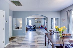 Easley house for rent - A dining room with a wooden table and chairs.