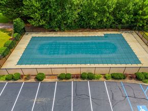 Easley house for rent - A small pool surrounded by a parking lot.