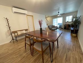 Kapolei apartment for rent - A dining room with a wooden table and chairs.