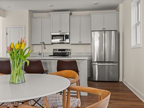 South Burlington apartment for rent - A kitchen with a refrigerator, stove, and microwave.